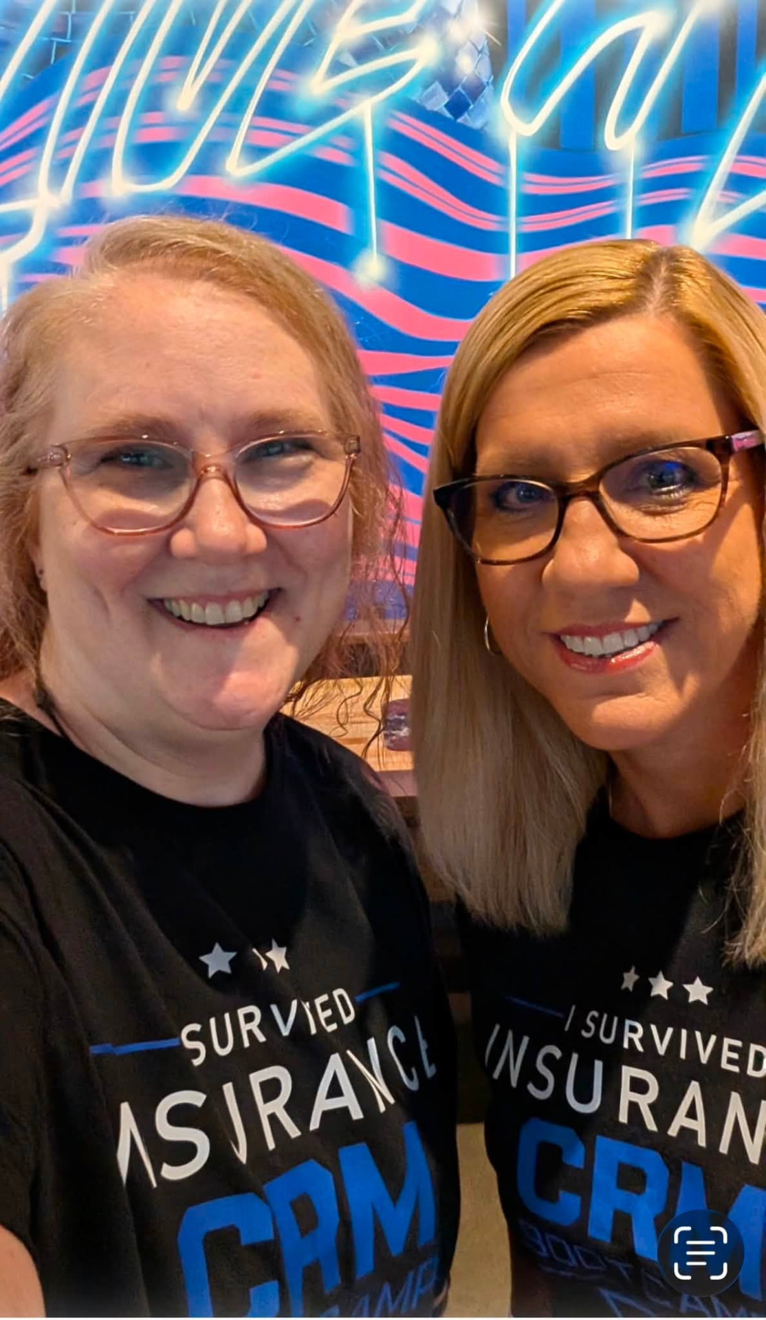 Two attendees celebrating after finishing the bootcamp
